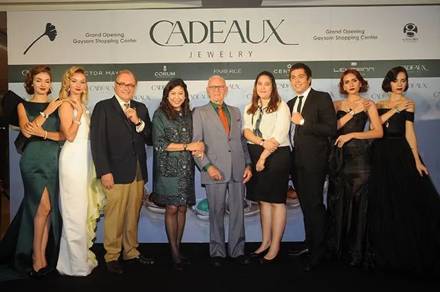Resanond Baechtold family, left to right: Philip A., Dr. Soipetch, Alexander, Natalila, Tevin, flanked by models.